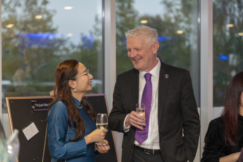 two people talking and laughing with one another