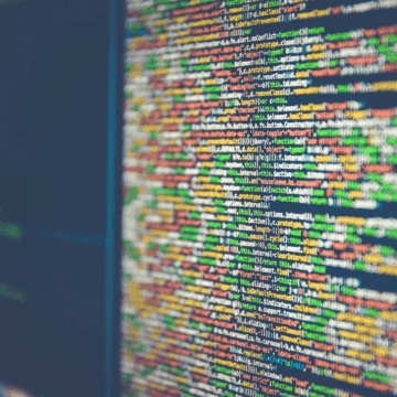 A computer screen with colourful lines of code on.