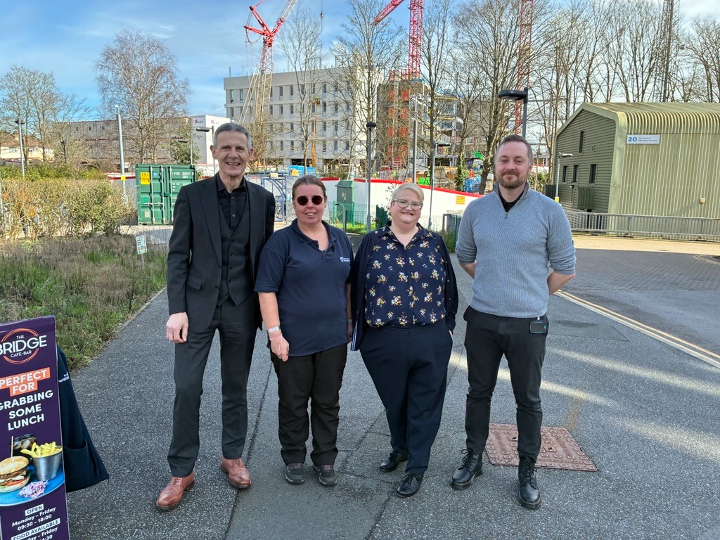 Keith, Amanda, Tracey and Elliot posing in front of the B75 site. 