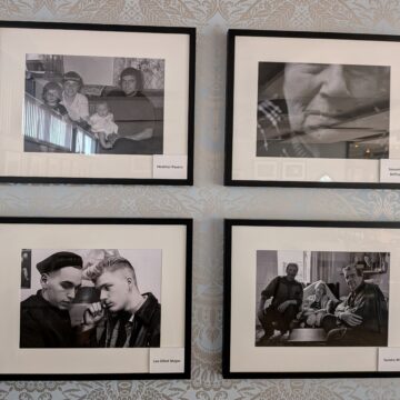Four framed, black and white photos on a wall.