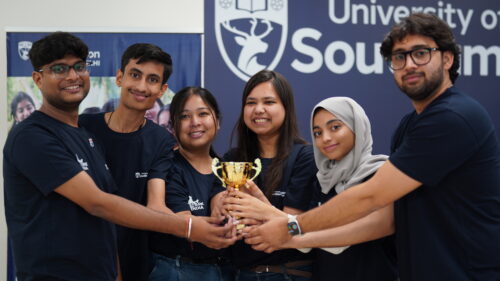 Group of students posing with a trophy following a workshop at the Spark India bootcamp