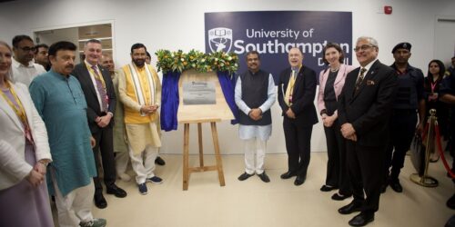 Staff members posing at the unveiling of the plaque at the Delhi Campus launch event