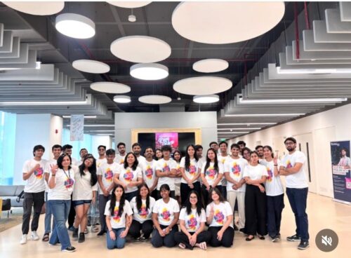 Group of students celebrating Holi on Delhi Campus, wearing matching t-shirts