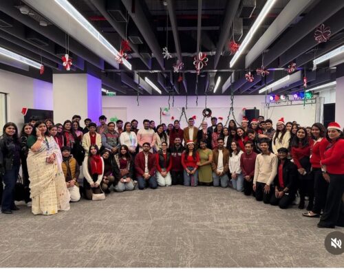 Group of students posing at a Christmas event on the Delhi campus