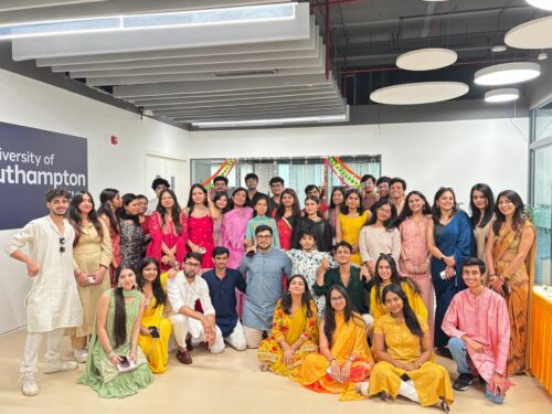 Group of students celebrating Diwali on Delhi Campus, wearing traditional clothing