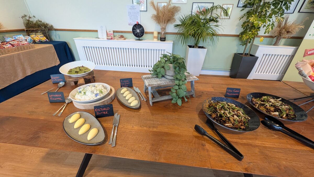 A table is spread with tasty looking food, including cultured butter, ricotta cheese and new forest mushroom dishes